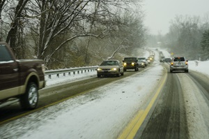 cars driving on snowy roads