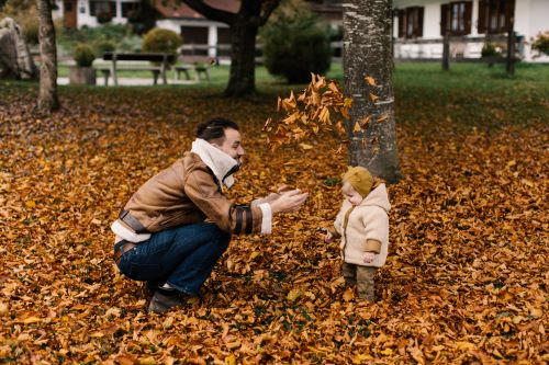 a little boy that is standing in the grass